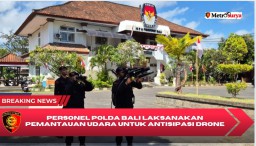 Personel Polda Bali Laksanakan Pemantauan Udara untuk Antisipasi Drone Liar di Sekitar Kantor KPU Provinsi Bali